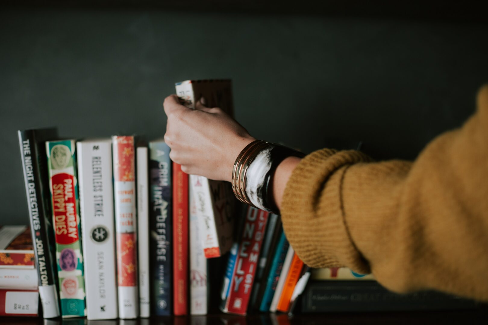picking a book off a shelf