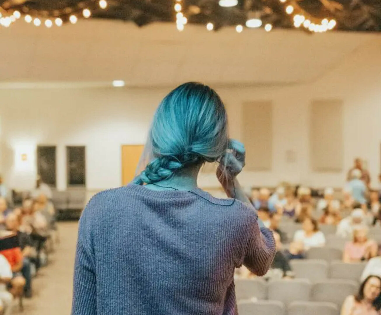 woman on stage about to speak